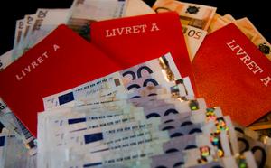 Des livrets A et des billets de banque (image d'illustration).