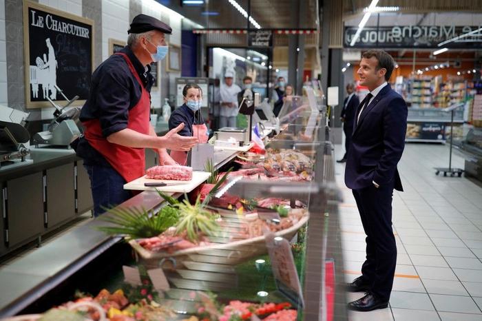 Emmanuel Macron supermarché AFP