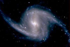 Un agrandissement de la galaxie spirale barrée NGC 1365, située dans l'amas du Fourneau, à environ 60 millions d'années-lumière de la Terre, grâce à la Dark Energy Camera.