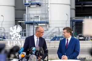 Chancellor and leader of the Christian Democratic Union (CDU) Friedrich Merz (L) and State Premier of Saxony-Anhalt 