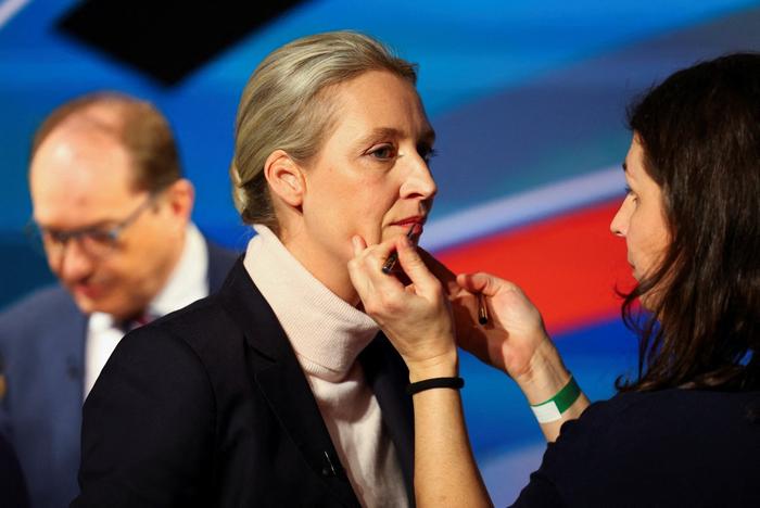 co-leader and main candidate of the far-right Alternative for Germany (AfD) party Alice Weidel (C) prepares ahead of a TV duel before the general election in Berlin, Germany, February 20, 2025. (Photo by Fabrizio Bensch / REUTERS / AFP)