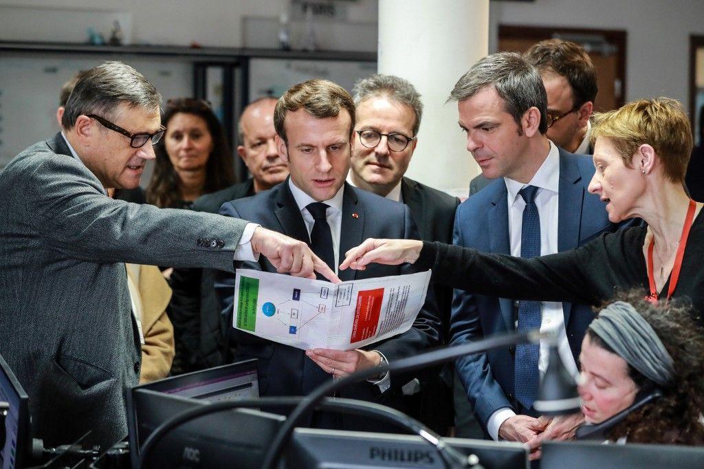 Emmanuel Macron Olivier Véran Martin Hirsch covid-19 AFP