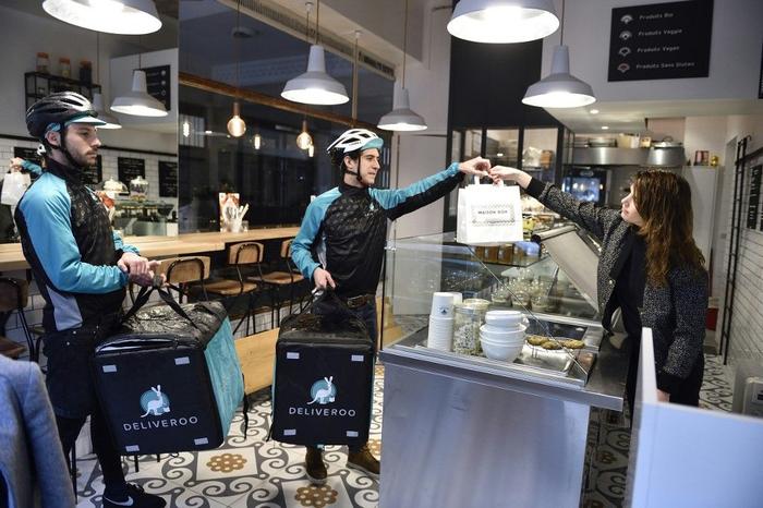 livraison Deliveroo repas nourriture livreurs commerces AFP
