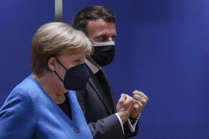 Emmanuel Macron Angela Merkel AFP