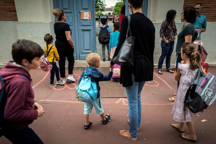 école parents enfants AFP