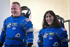 NASA astronauts Butch Wilmore (R) and Suni Williams, wearing Boeing spacesuits, depart the Neil A. Armstrong Operations and Checkout Building at Kennedy Space Center for Launch Complex 41 at Cape Canaveral Space Force Station in Florida to board the Boeing CST-100 Starliner spacecraft for the Crew Flight Test launch, on June 5, 2024. Boeing on June 5 will try once more to launch astronauts aboard a Starliner capsule bound for the International Space Station. Liftoff is targeted for 10:52 am (1452 GMT) for a roughly one-week stay at the orbital laboratory. (Photo by Miguel J. Rodriguez Carrillo / AFP)