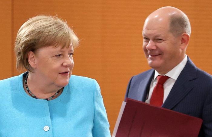 Angela Merkel Olaf Scholz AFP