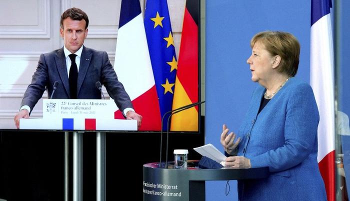 Emmanuel Macron Angela Merkel AFP