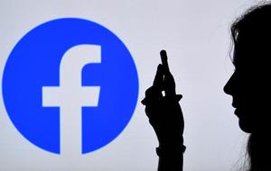 Facebook logo smartphone AFP